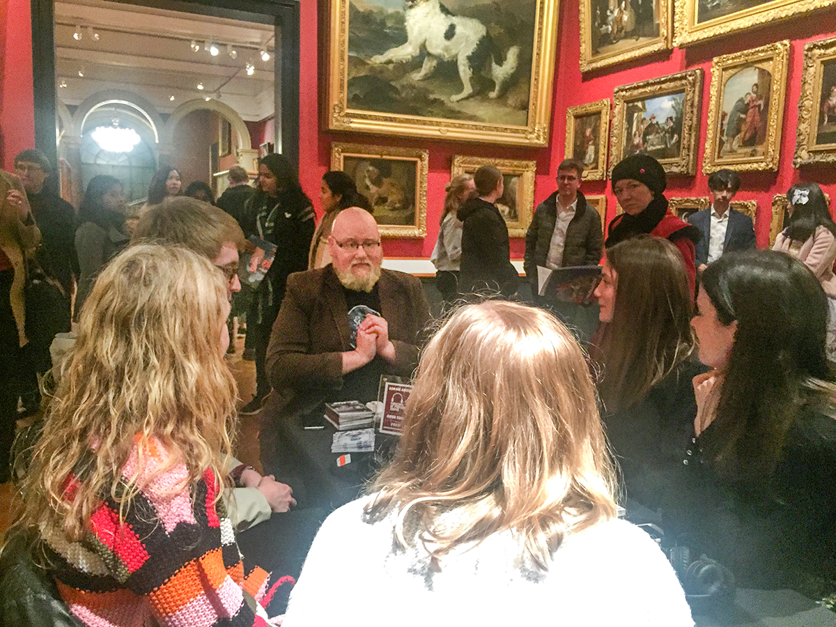 Meeting the first group of visitors (and/or posing for a Last Supper painting).